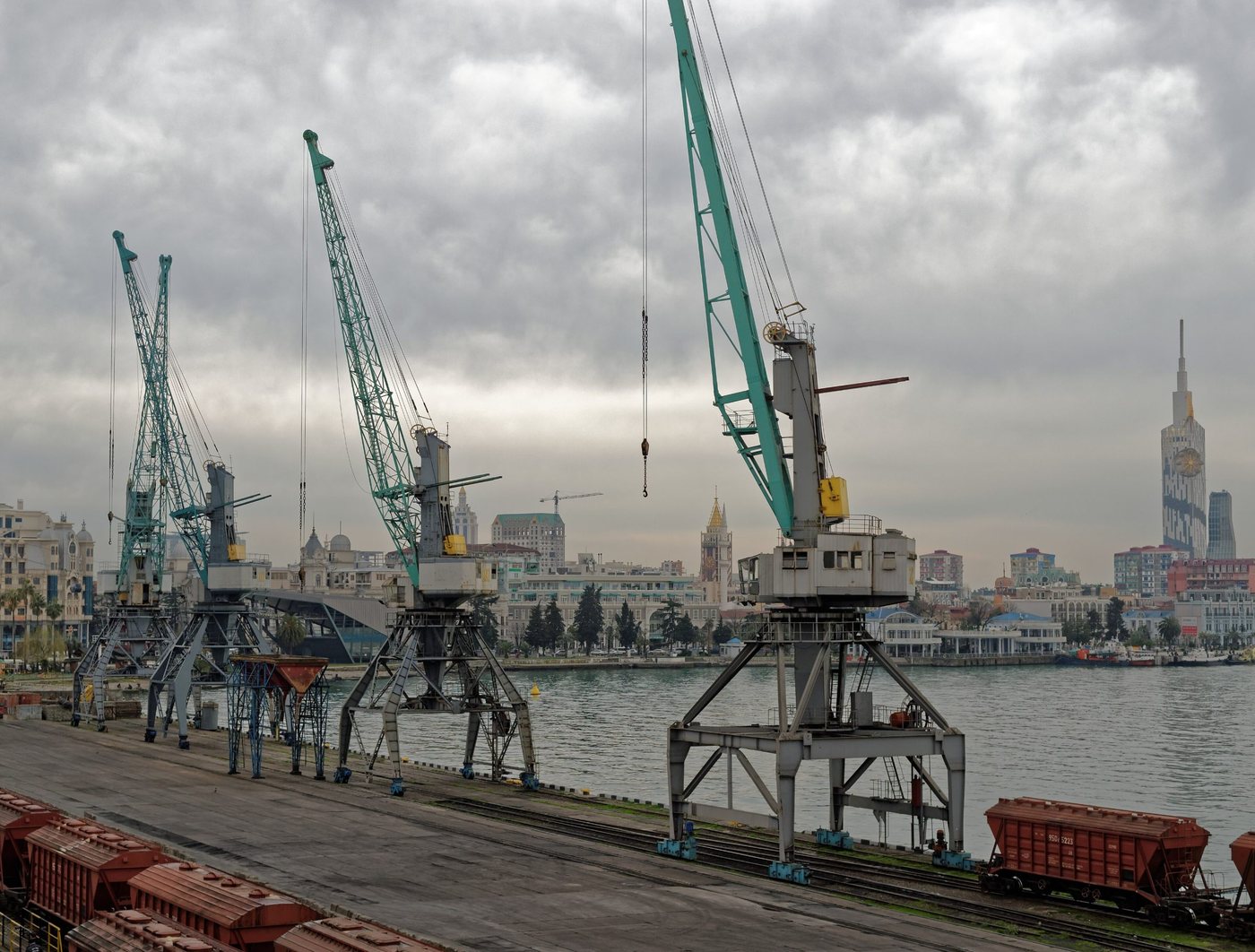 Quayside cranes at Batumi seaport on Georgia's Black Sea coast, with the city behind